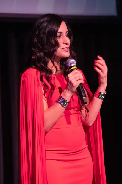 Speaker addressing the audience at the Be Great! Summit