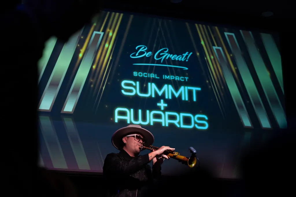 The 2025 Be Great! Social Impact Summit + Awards stage in Orlando